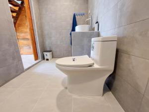 a bathroom with a white toilet in a room at Billabong Village in Ko Phangan +17 photos