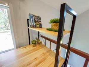 a shelf in a room with a bookshelf at Billabong Village in Ko Phangan