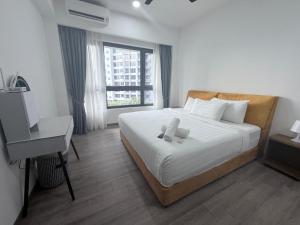 Ένα ή περισσότερα κρεβάτια σε δωμάτιο στο Agile Bukit Bintang By AR +245 φωτογραφίες