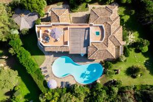 an aerial view of a house with a swimming pool at Villa Flor, Exclusive House with Pool in Stintino in Stintino