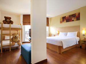 Postel nebo postele na pokoji v ubytování Ibis Pattaya + 70 fotografií