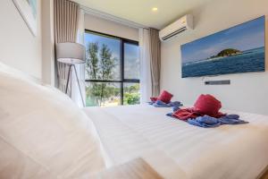 Katil atau katil-katil dalam bilik di Space 404 - 1BDR with Coworking, Pool & Gym Access +22 gambar