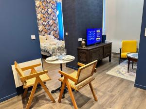 O zonă de relaxare la Craft Home - Le tapissier - Balneo - Parking privé