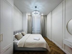 Ένα ή περισσότερα κρεβάτια σε δωμάτιο στο Respublica Luxe apart