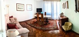 a living room with a couch and a table at Ca' Giulia - Biennale - free wifi fiber in Venice