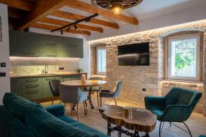 a living room with a couch and a table at Apartman Rustic Charm in Livno