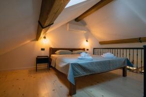 Postel nebo postele na pokoji v ubytování Apartman Rustic Charm + 10 fotografií