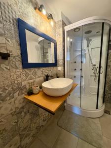 a bathroom with a sink and a shower at Luna House Busteni in Buşteni +22 photos