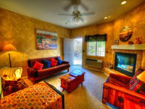 a living room with a couch and a fireplace at Stagecoach Trails Guest Ranch in Yucca