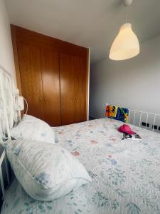 a bedroom with a large bed with a wooden headboard at Malpais in Puertito de Güímar