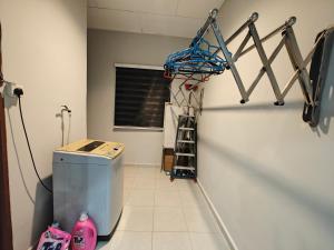 a gym with a basketball hoop hanging on a wall at Sakan Moslim only, 4 airconds, wifi in Alor Setar