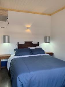 Una cama o camas en una habitación de Rua D
