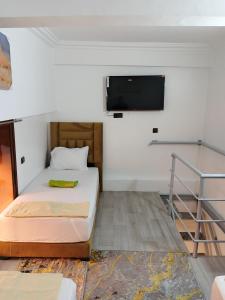 Ένα ή περισσότερα κρεβάτια σε δωμάτιο στο Le Palmier de Guéliz