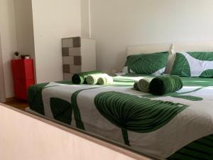 Postel nebo postele na pokoji v ubytování The Kaktus House - vicino San siro e Rho Fiera