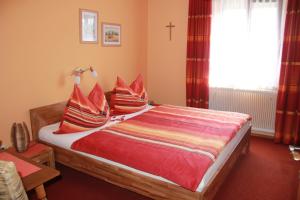 A bed or beds in a room at Haus Regina
