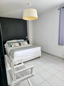 Ένα ή περισσότερα κρεβάτια σε δωμάτιο στο Cap Corse une villa dans un nid de verdure