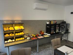 a counter with a bunch of fruit on it at Park Central Tapolca - Apartments in Miskolctapolca