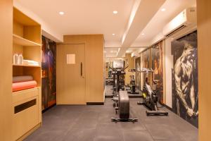 a gym with treadmills and machines in a room at Keys Lite by Lemon Tree Hotels, Jaipur in Jaipur