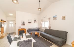 a living room with a couch and a table at Gorgeous Apartment In Vir With Wifi in Vir +10 photos