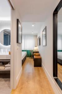 a room with a bed and a bathroom at Room Mate Cosmo - City Centre, Valencia in Valencia +73 photos