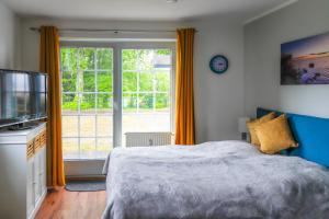 Giường trong phòng chung tại App 7 Granitzblick, Seedorf