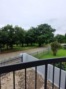 a balcony with a view of a street at River Suite at On-the-Up in Potchefstroom