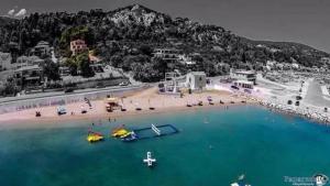 an aerial view of a beach with boats in the water at Avra Studios in Kymi