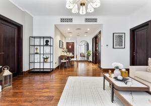 a living room with a couch and a table at 2BR Downtown Dubai 5 Min Walk to Dubai Mall & Burj in Dubai +40 photos