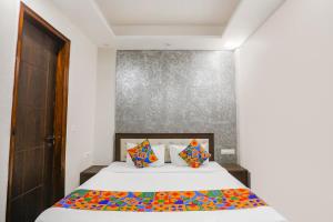 Ένα ή περισσότερα κρεβάτια σε δωμάτιο στο FabHotel Signature Inn I