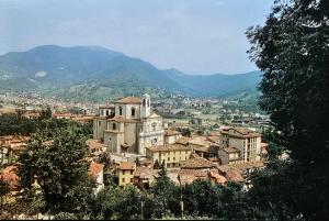 a view of a town with mountains in the background at Phi Apartments Bergamo in Nembro