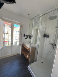 a bathroom with a shower and a sink at Casa Mar da Vila in Noya +57 photos