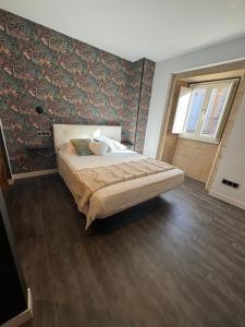 a bedroom with a large bed in a room at Casa Mar da Vila in Noya +57 photos