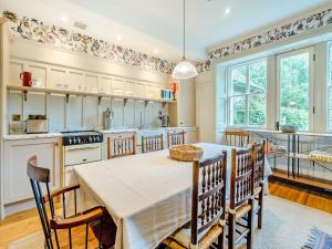 a dining room with a table and chairs in a kitchen at Uk47811 - Baillies Cottage in Kinloch Rannoch