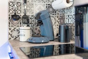 a kitchen counter with a mixer on a shelf at Fewo S22 in Regen +13 photos