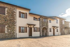 an image of a house with a stone driveway at House with garden and fireplace in Osséja