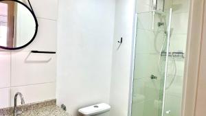 a bathroom with a shower and a toilet at Conforto na Liberdade - AC e Quarto privativo in Sao Paulo +42 photos