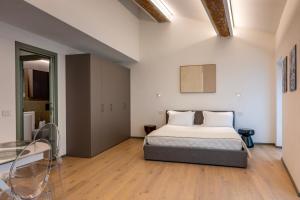 a bedroom with a bed in a room at Residenza Wega - Luxury Apartments Verona in Verona