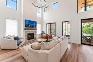 a living room with two couches and a fireplace at Lakeside Retreat in Kingston
