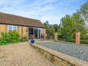 a brick house with a patio in front of it at Overshot - Uk45388 in Crewkerne