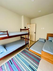 Postel nebo postele na pokoji v ubytování Casa charmosa e aconchegante em Cabo Frio