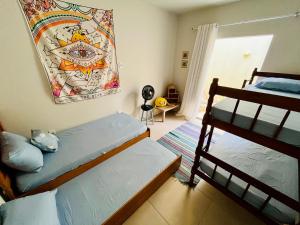 Postel nebo postele na pokoji v ubytování Casa charmosa e aconchegante em Cabo Frio