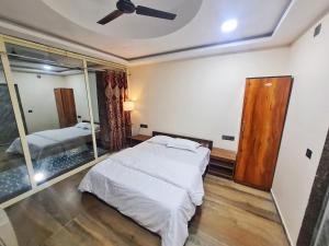 Ένα ή περισσότερα κρεβάτια σε δωμάτιο στο The Moonland Resort