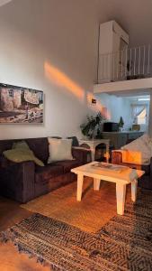 a living room with a couch and a coffee table at Anamcara Villa 2, Natal Midlands Balgowan in Balgowan
