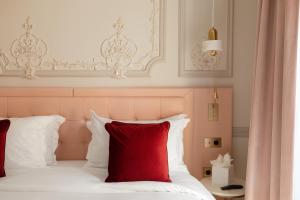 Ένα ή περισσότερα κρεβάτια σε δωμάτιο στο Mode Paris Aparthotel