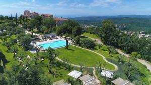 an aerial view of a resort with a swimming pool at Château Saint-Martin & Spa, Oetker Hotels in Vence