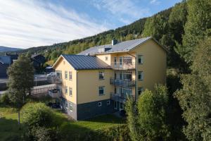 an aerial view of a house in the mountains at Åre Travel - Brygghusen in Åre