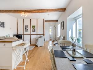 a dining room and living room with a table and chairs at Rambler's Hideaway - Uk45414 in Eaton Bishop