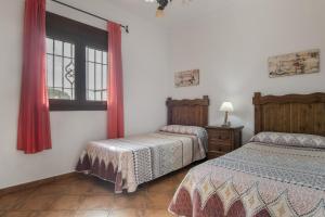 Postel nebo postele na pokoji v ubytování Casa Carmelo Conil 1 + 17 fotografií