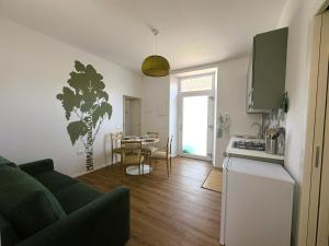 a living room with a couch and a table at L'Albero in Bergamo