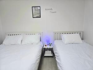 Ένα ή περισσότερα κρεβάτια σε δωμάτιο στο Rinn Stay - Bongcheon Station, Seoul National Uni, Airport Bus